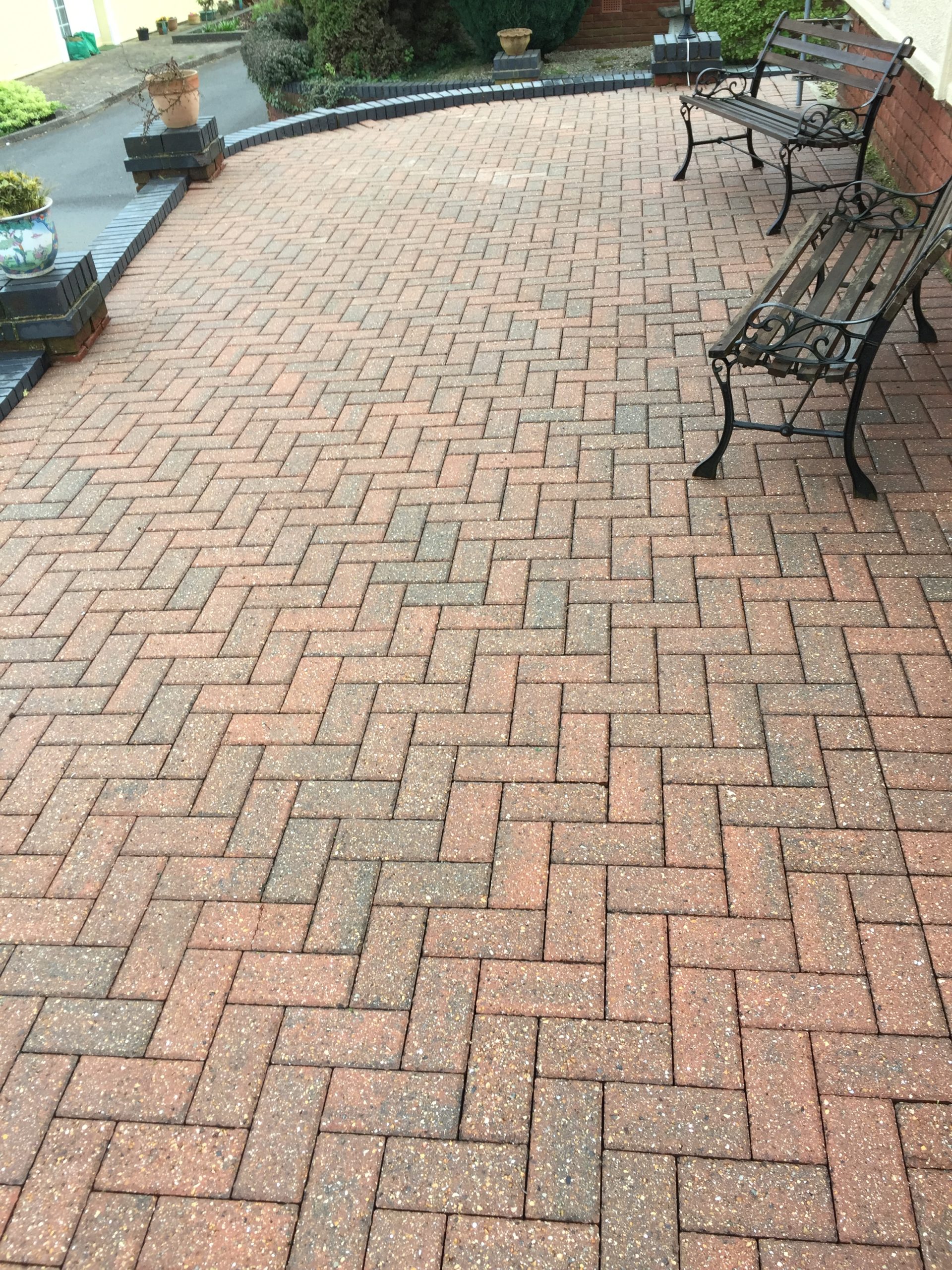 Clean herringbone block paved driveway after cleaning