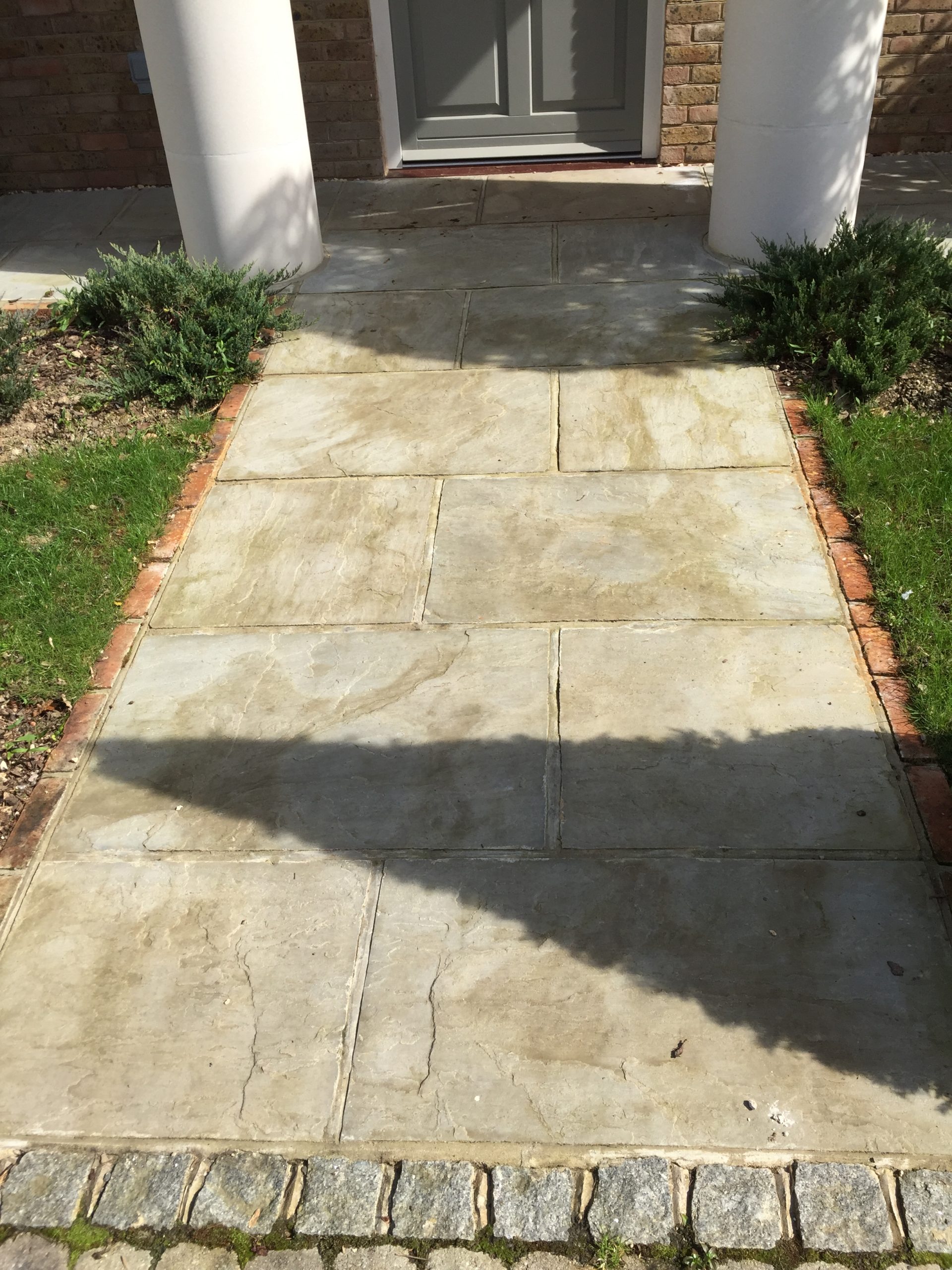 Freshly cleaned sandstone patio, still wet