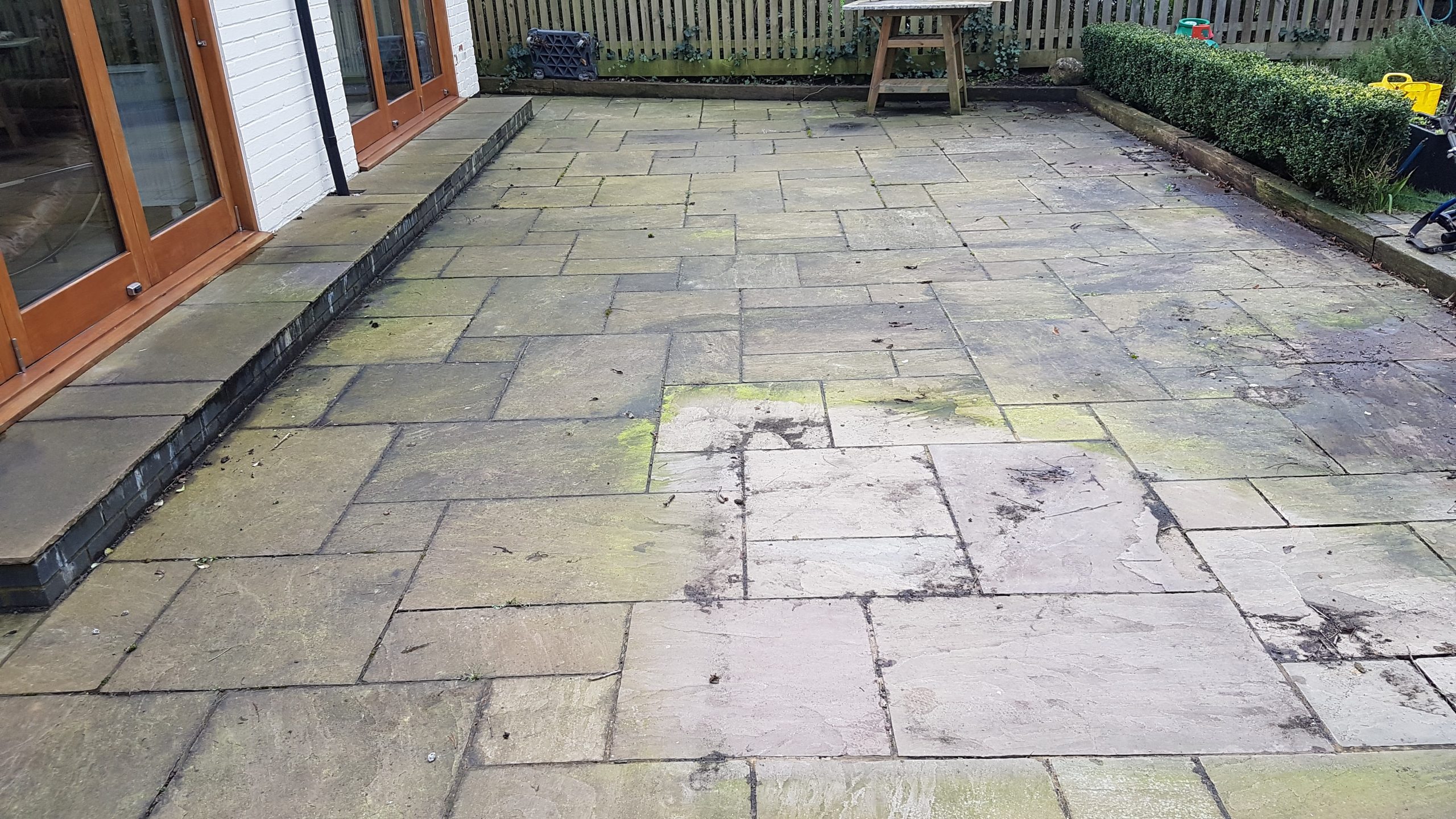 Dirty patio before cleaning